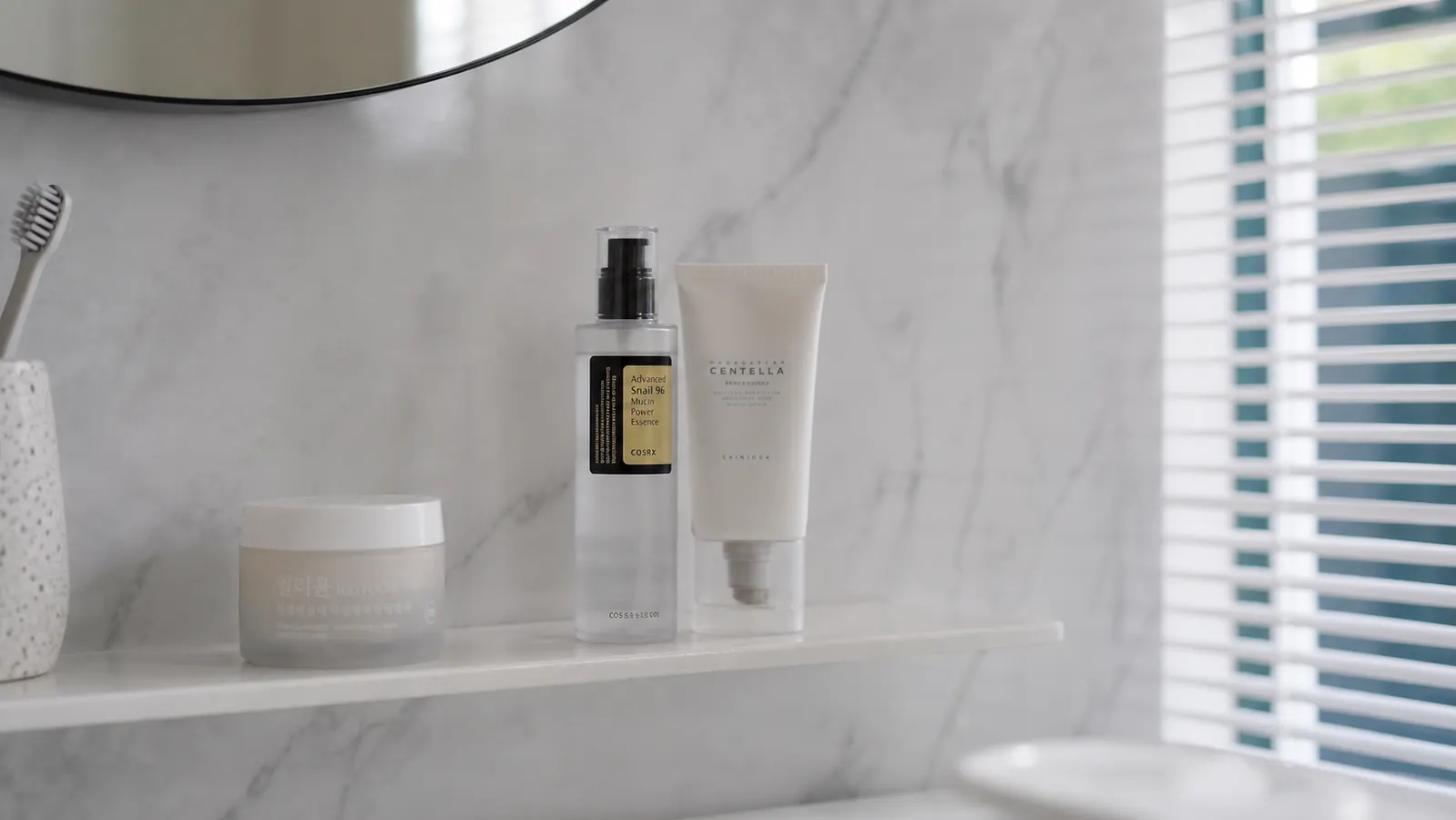 Minimal skincare shelf with just a few bottles, clean and uncluttered